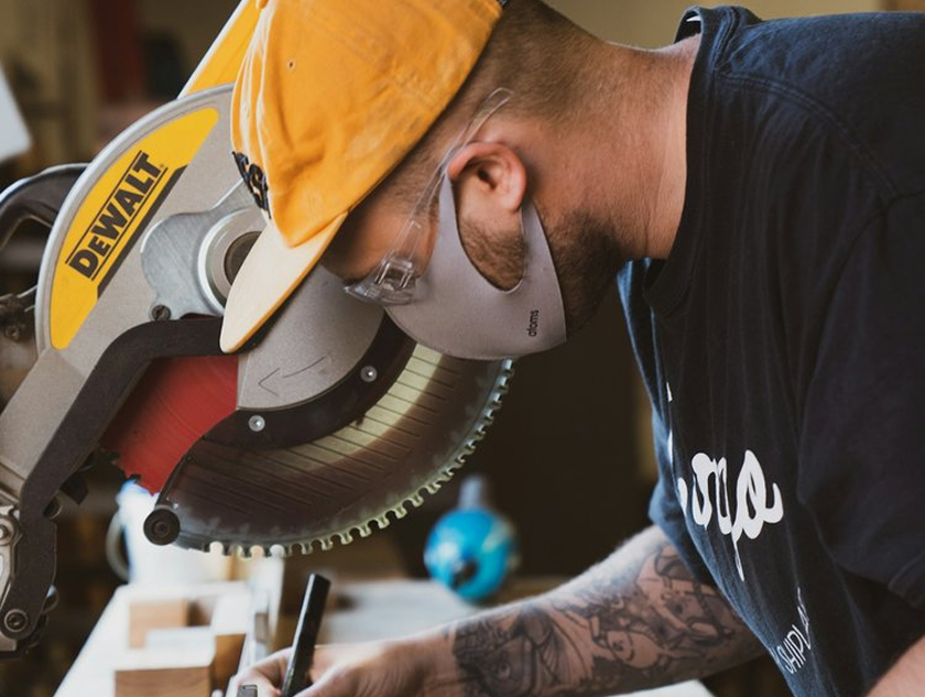 Carpenter cutting trim for a kitchen remodel in Cedar Park, Texas.