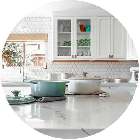 Beautiful kitchen remodel in Round Rock, Texas with new white cabinets, quartz countertops and a clean subway tile backsplash.