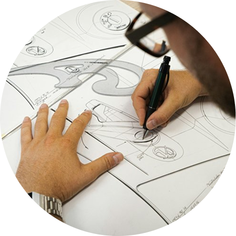 Designer working at a drafting table on a patio redesign.