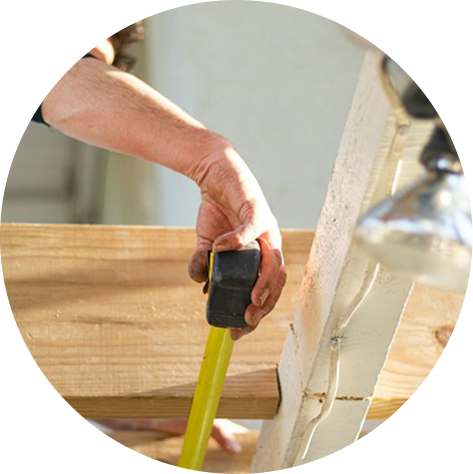 A carpenter framing a deck in Leander.
