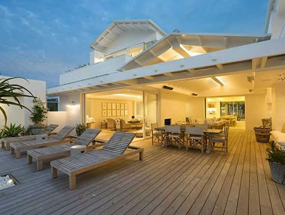 A beautiful deck with a large patio cover.