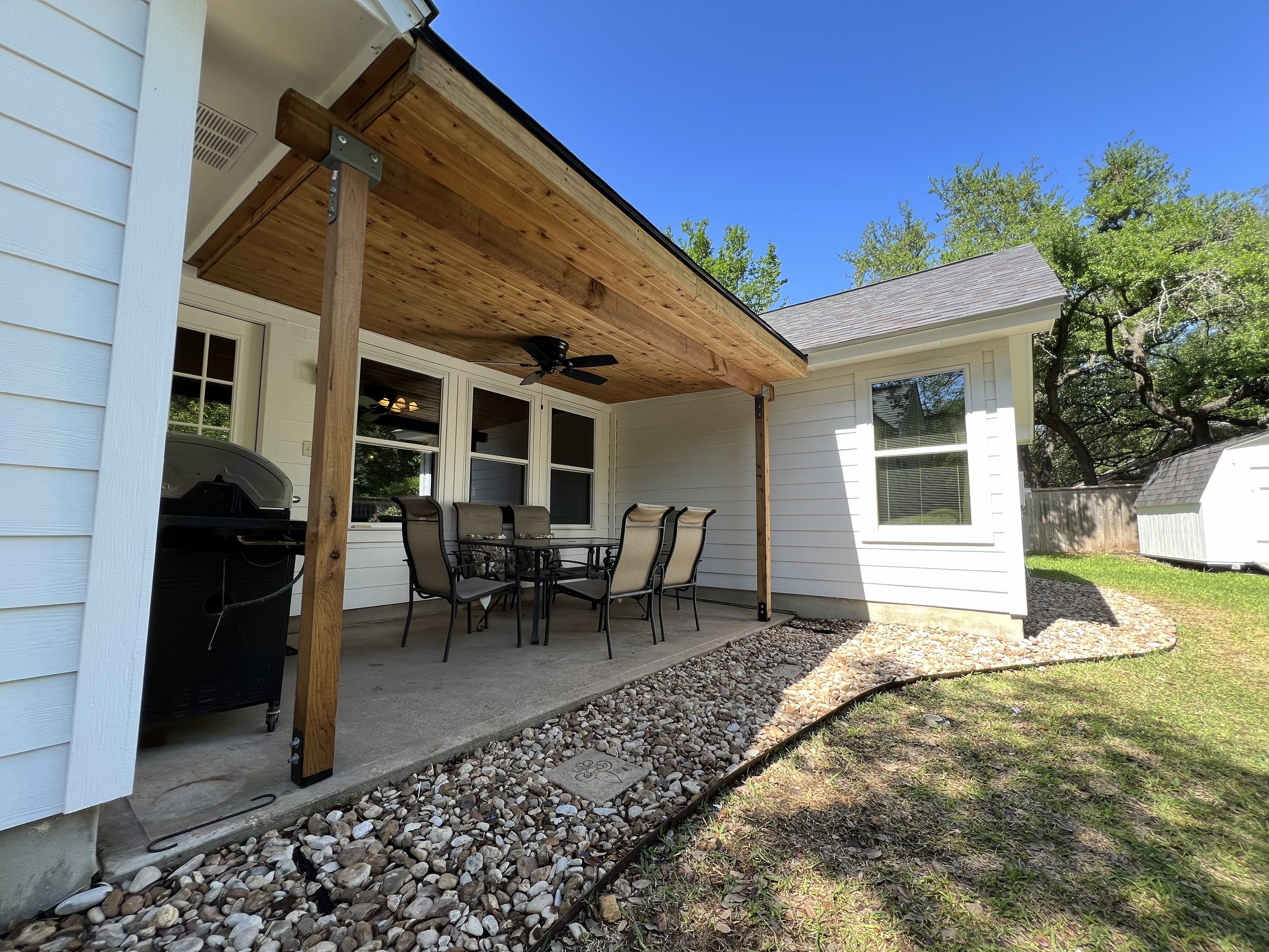 Covered Georgetown patio with cedar soffit and masonry columns