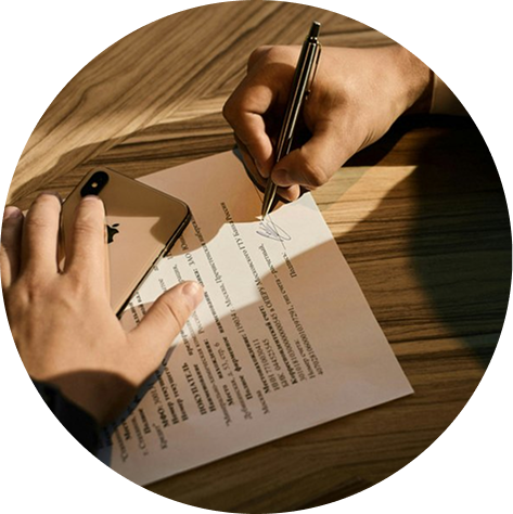 A Round Rock homeowner signing a remodeling contract.