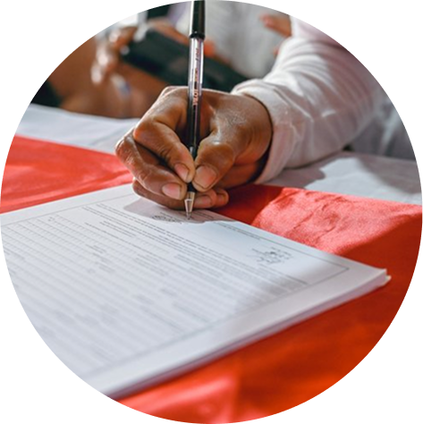 An owner signing a contract for a remodel project in their backyard.