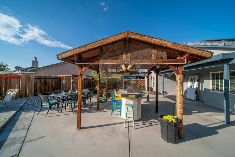 Peaked freestanding patio cover made from western red cedar.
