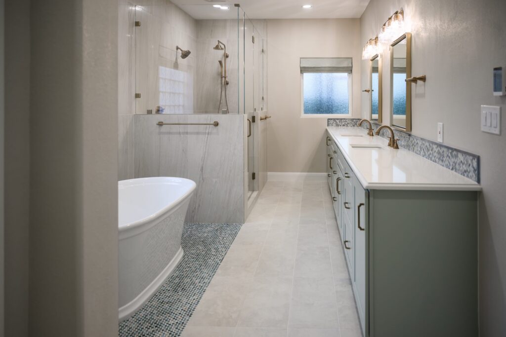 Finished Georgetown primary bathroom with tub, shower, and double vanity