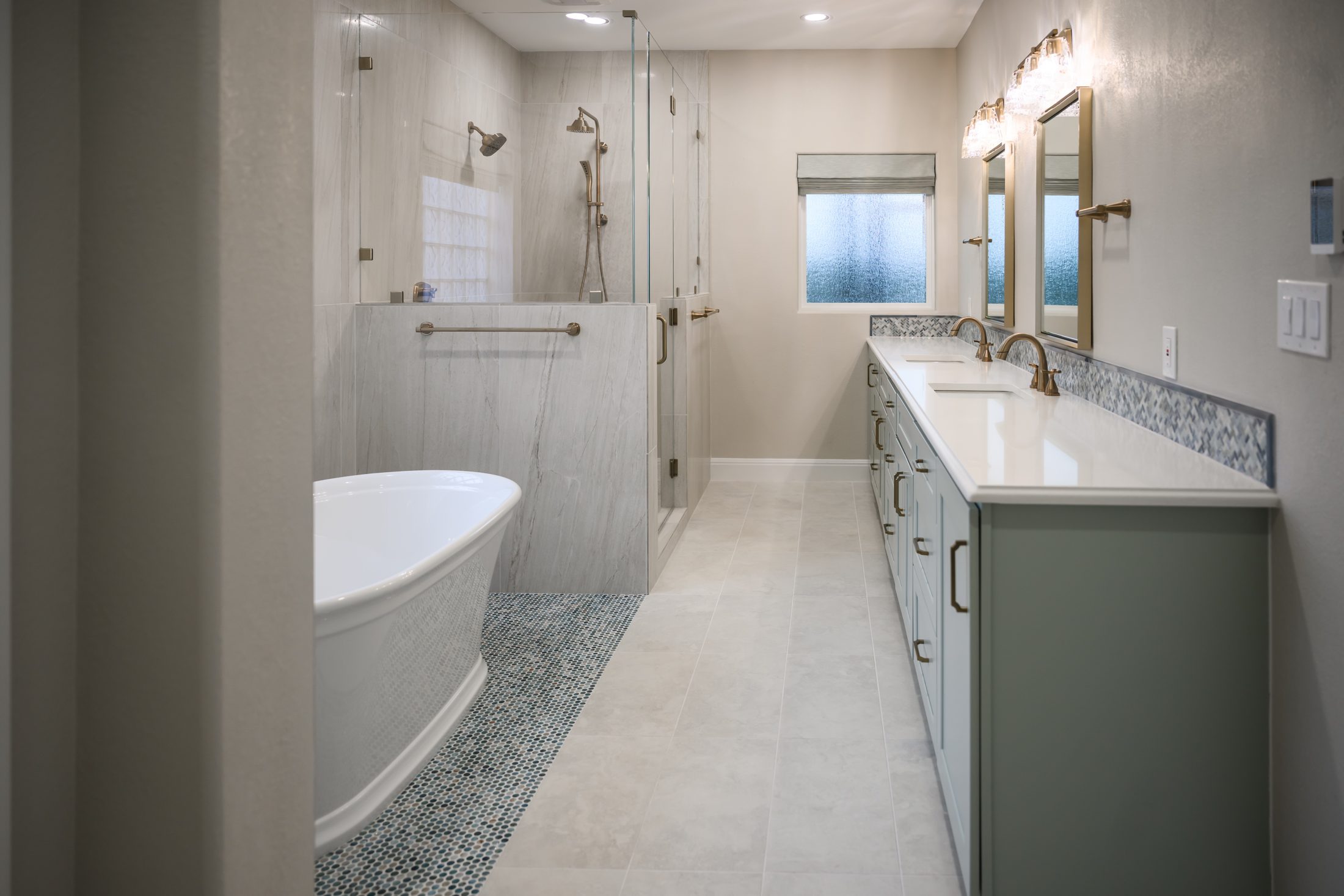 Finished Georgetown primary bathroom with tub, shower, and double vanity