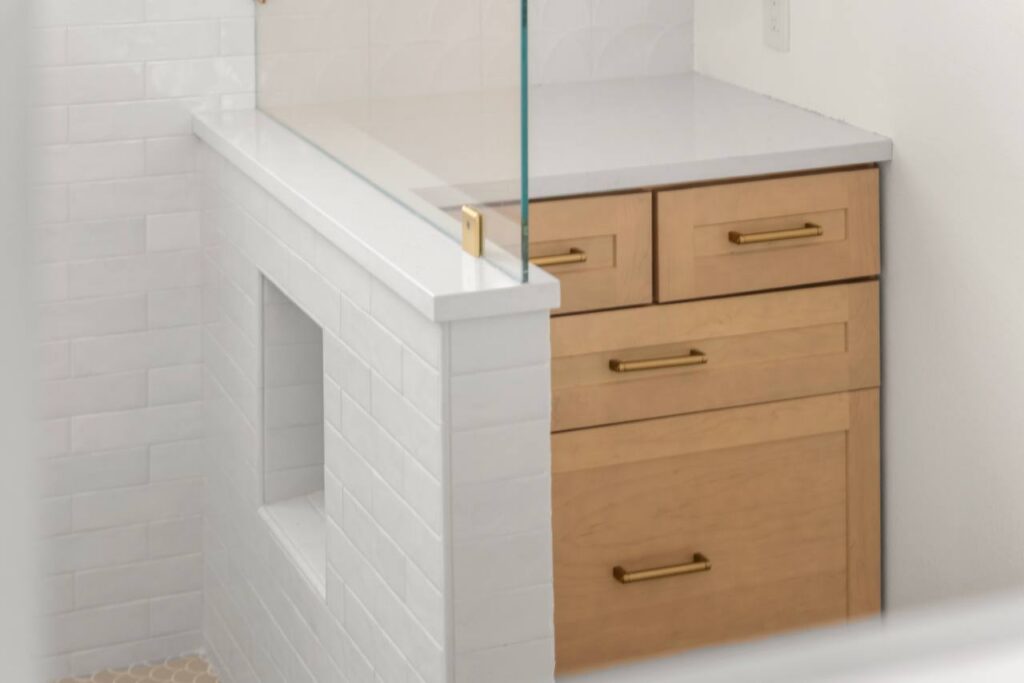Lomita Verde shower floor with scallop mosaic tile and linear drain