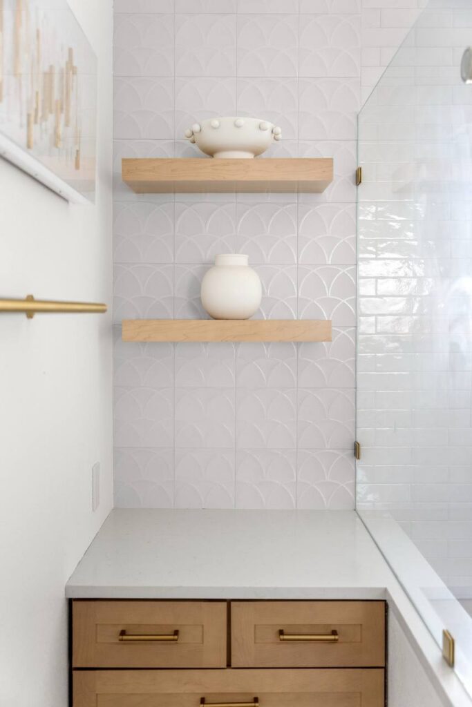 Lomita Verde vanity with white quartz top and warm wood cabinetry
