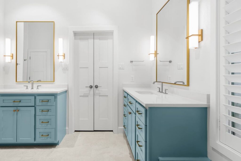 Hedgebrook Way bathroom double vanity with blue cabinetry and white quartz