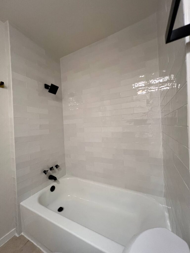 Thornridge Dr. shower with white subway tile and black fixtures